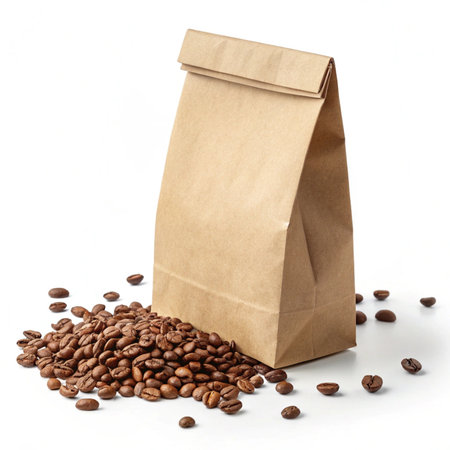 Brown paper bag with coffee beans isolated on white background. Close up.の素材