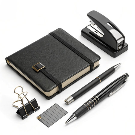 Office supplies isolated on white background. Black leather notebook, pen, stapler, paper clips, black stapler and black clip.の素材