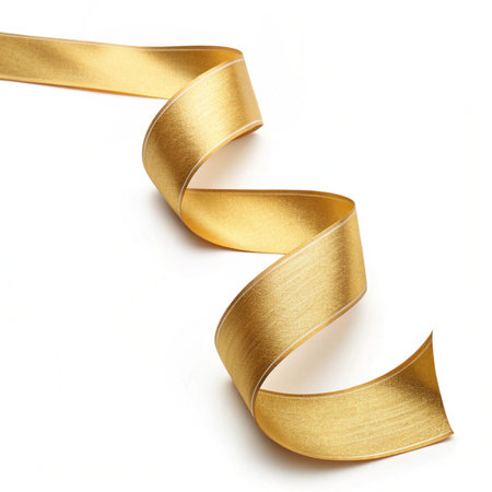 Shiny satin ribbon in yellow color isolated on white background close upの素材
