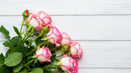 Bouquet of pink roses on white wooden background, copy spaceの素材