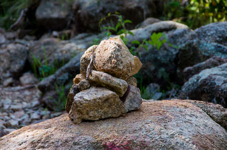 Close-up of a stone man as a marker for hikers on the French island of Corsicaの写真素材