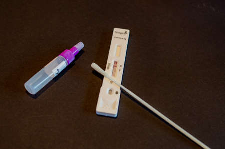 BAMBERG, GERMANY - 8.4.2021. Covid-19 antigen test Kit for a rapid covid check from Hotgen in front of black backgroundのeditorial素材