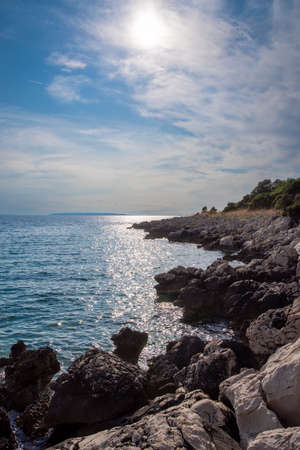 Rocky coast of the Croatian island of Pag in the sunlight, portrait formatの写真素材