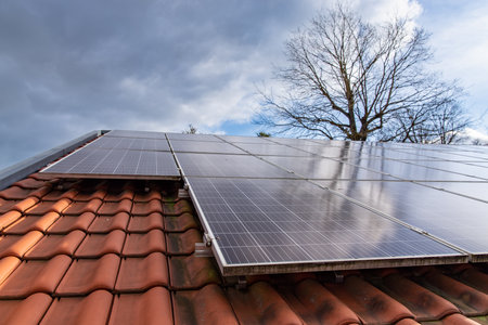 Photovoltaic modules in front of blue and cloudy autumn sky