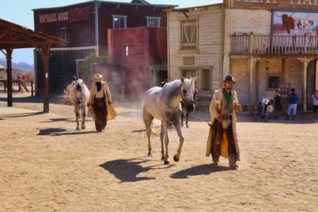 Western set in minihollywood in Tabernas desert, Almer?a, Andalusia, Spain. Two men with horses, bandits.のeditorial素材