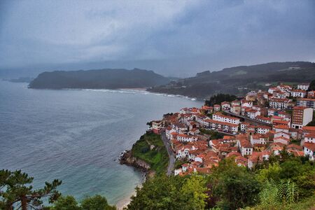 Lastres town on a cloudy and rainy dayの写真素材
