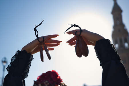 Detail of hands of young flamenco woman, playing castanets. Concept of flamenco, dancer, typical Spanish dance.の写真素材