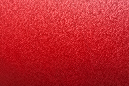 Red leather background with rough surface, this photo close up form stoolの写真素材
