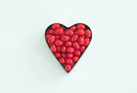 Heart of pills isolated on white の写真素材