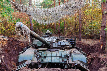 The tank from the hidden position is disguised in the trenchの写真素材