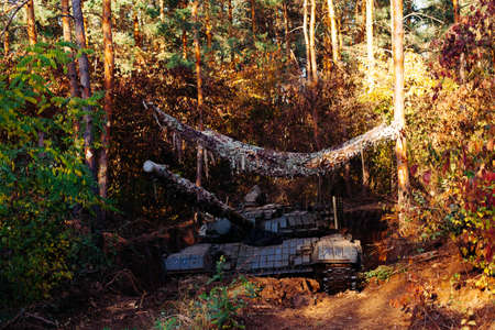 The tank from the hidden position is disguised in the trenchの写真素材