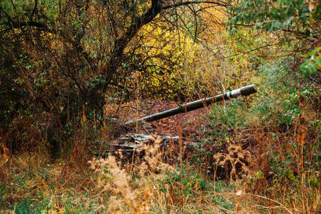 real battle tanks disguised in the trenches Donbass Ukraineの写真素材