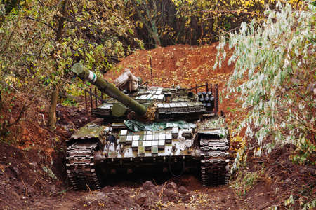 real battle tanks disguised in the trenches Donbass Ukraineの写真素材