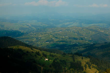 Wooden hut in Carpathians on the gorge under a cloudy skyの写真素材
