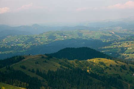 Wooden hut in Carpathians on the gorge under a cloudy skyの写真素材