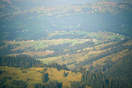 Wooden hut in Carpathians on the gorge under a cloudy skyの写真素材