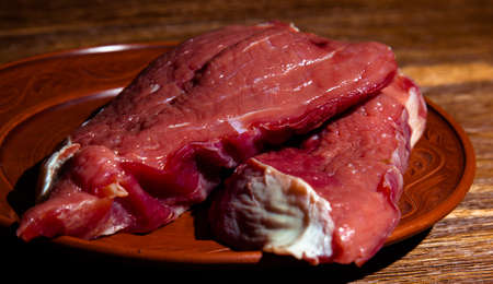 two steak on a plate rawの写真素材