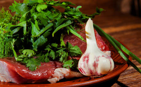 raw beef and fresh garlic cilantro dillの写真素材