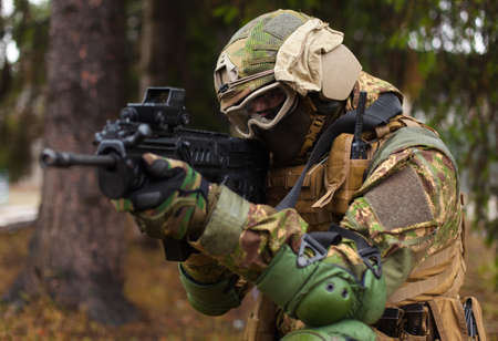 Ukraine soldier is ready to shoot from the kneeの写真素材