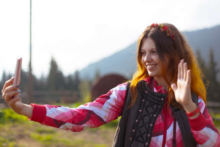 girl in the carpathian mountains makes selfie summer dayの写真素材