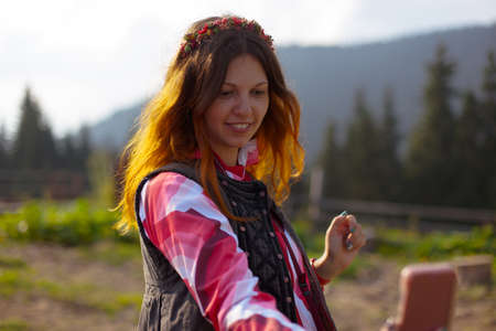 girl in the carpathian mountains makes selfie summer dayの写真素材