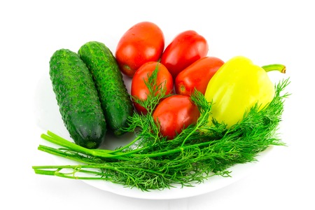 Vegetable: tomato, cucumber, pepper dill isolated on white backgroundの写真素材