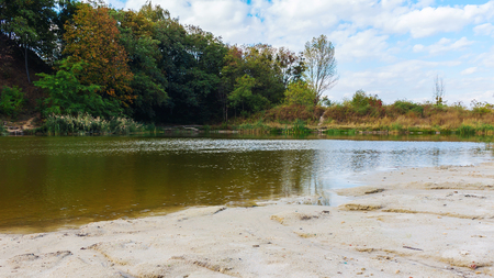 Beautiful landscape, sandy beach on the lake in park, early fall, Lviv, Ukraineの写真素材