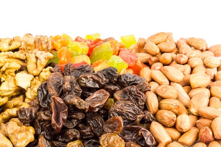 Mix of healthy nuts and dried fruits isolated on white backgroundの写真素材