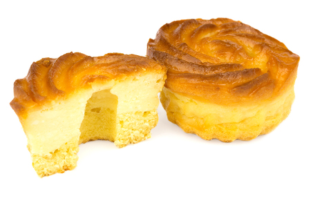 One whole and half cheesecake isolated on white background.の写真素材