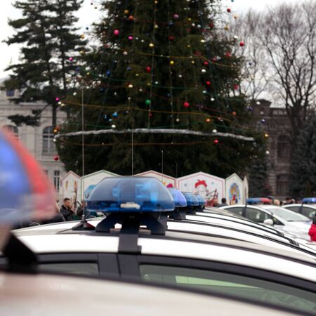Row of police cars, with blue and red flashing sirens, Ukraine. selective focusの写真素材