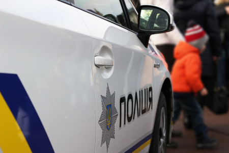 New police car, in front of people. ukrainian police reformの写真素材