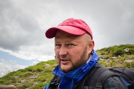Close-up portrait of men with backpack who traveling in the mountains, Carpathians, Ukraineの写真素材