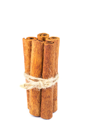 Group of cinnamon sticks isolated on white background, close-upの写真素材