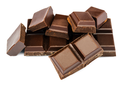 Dark chocolate cubes isolated on white backgroundの写真素材