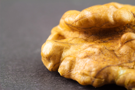 Kernel walnut on black background macro image