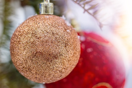 Christmas balls on the fir branch covered snow. Christmas Backgroundの写真素材