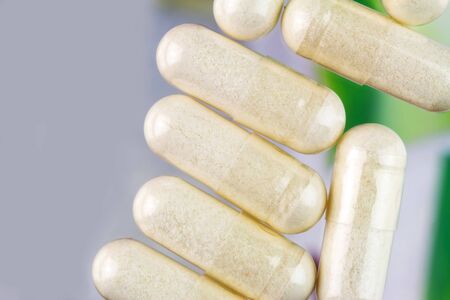 Glucosamine capsules, food supplement pills, top view, macro imageの写真素材