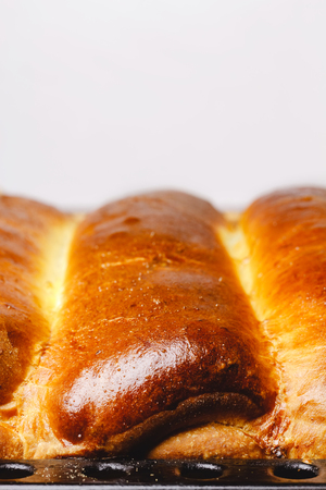 Hot, fresh golden brown baked homemade sweet pies, strudel with space for textの写真素材