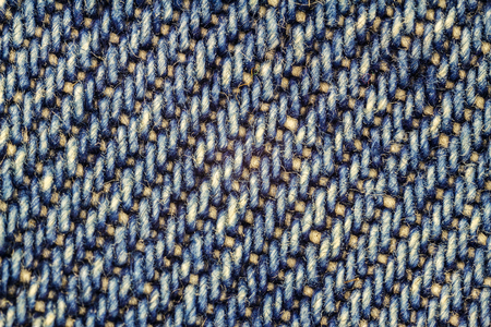 Macro image of blue jeans, denim texture background