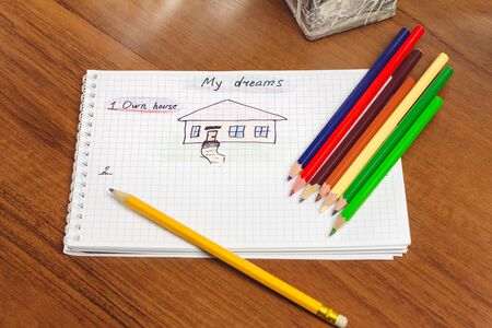 My dream, own house written text and drawing on the notepad, color pencils on the table. concept of visualization futureの写真素材
