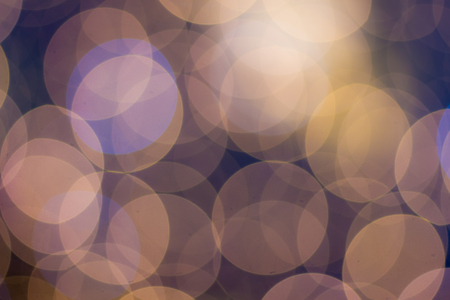Blurred and defocused abstract background with soft bokeh circles in warm tones, overlay conceptの写真素材