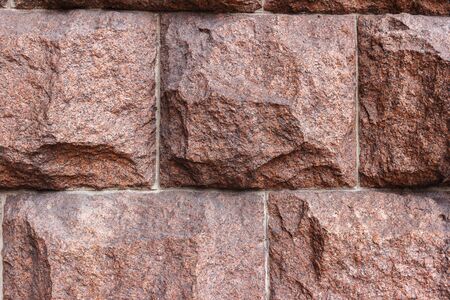 Rustic stone red granite, close-up view, abstract background