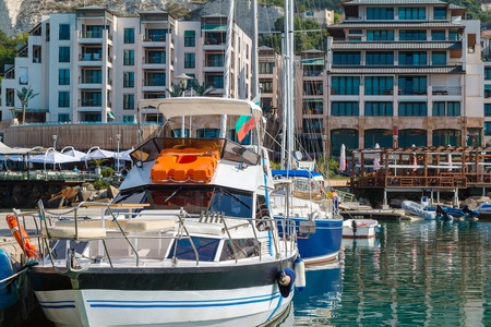 Yachts, sailing boats and pleasure boats are moored in marina of Balchik city in black sea coast at Bulgaria.の写真素材
