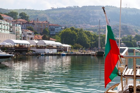 Bulgarian flag on pleasure boat, moored in marina of Balchik city in black sea coast at Bulgaria.の写真素材