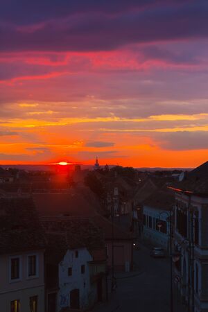 Awesome scenery of sunset over the ancient european city Sibiu in Romania.の写真素材