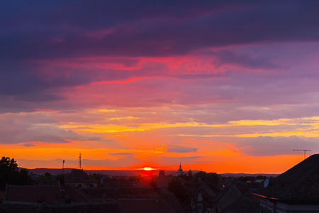 Awesome scenery of sunset over the ancient european city Sibiu in Romania.の写真素材
