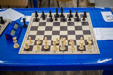 All chess pieces on chessboard, before the start game.の写真素材