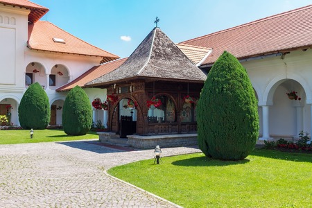 Exterior, facade of building Brancoveanu orthodox monastery with courtyard area in Sambata de Sus...