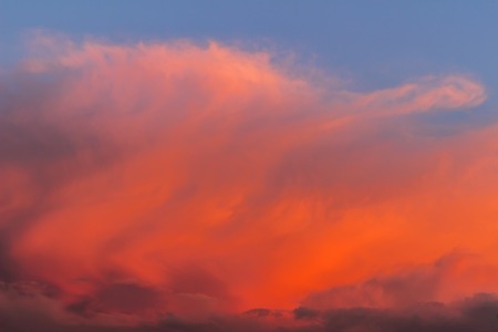 Cloudscape of red cloud on evening sunset sky.
