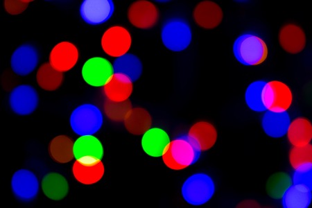 Blurred and defocused abstract multicolor background with christmas lights, soft multicolored bokeh...